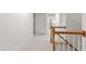 View of upstairs hallway with stair railing leading to bedrooms at 5123 Richland Dr, Raleigh, NC 27612