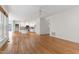 Open living space with hardwood floors connecting kitchen and living areas at 5123 Richland Dr, Raleigh, NC 27612