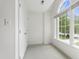 Bright sitting area with vaulted ceilings, backyard views and plush carpet at 5123 Richland Dr, Raleigh, NC 27612