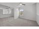 Bedroom with a large window, ceiling fan, and closet with mirrored doors at 5300 Roan Mountain Pl, Raleigh, NC 27613
