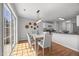 Inviting dining area with natural light from the sliding glass door, complemented by stylish decor at 5300 Roan Mountain Pl, Raleigh, NC 27613