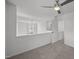 Hallway with ceiling fan, gray carpet and white walls at 5300 Roan Mountain Pl, Raleigh, NC 27613