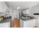 Well-equipped kitchen featuring modern appliances, ample counter space, and a functional layout at 5300 Roan Mountain Pl, Raleigh, NC 27613