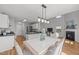 Bright, open floor plan showcasing a seamless transition from the dining area to the well-equipped kitchen at 5300 Roan Mountain Pl, Raleigh, NC 27613