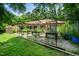 The backyard features raised garden beds and trellises, perfect for gardening enthusiasts at 5301 Thayer Dr, Raleigh, NC 27612