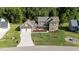 Spacious home featuring a manicured lawn, long driveway, and a convenient three-car garage at 543 Allessandra Dr, Clayton, NC 27527