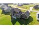 Aerial view of house's back exterior showcasing spacious yard, covered patio, and quality construction at 543 Allessandra Dr, Clayton, NC 27527