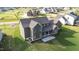 Aerial view of house's back exterior featuring covered patio, large windows, and well-maintained lawn at 543 Allessandra Dr, Clayton, NC 27527