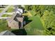 Expansive backyard of brown house with lush lawn and wooded area, perfect for outdoor activities at 543 Allessandra Dr, Clayton, NC 27527