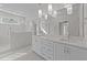 Bathroom with double vanity, stone countertops, and glass walk-in shower at 543 Allessandra Dr, Clayton, NC 27527