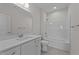 Bright bathroom with single sink vanity, tub-shower combo, and modern fixtures at 543 Allessandra Dr, Clayton, NC 27527