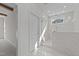 Elegant bathroom with glass-enclosed shower and white marble tile surround at 543 Allessandra Dr, Clayton, NC 27527