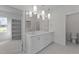 Bathroom with double vanity, stone countertops, and neutral tile flooring at 543 Allessandra Dr, Clayton, NC 27527