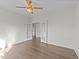 Bedroom features wood floors, ceiling fan, neutral walls, and French doors at 543 Allessandra Dr, Clayton, NC 27527