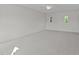 Neutral bedroom featuring a ceiling fan, plush carpet, and sunlit windows at 543 Allessandra Dr, Clayton, NC 27527