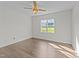Bright bedroom showcases natural light, ceiling fan, and an exterior view at 543 Allessandra Dr, Clayton, NC 27527