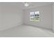 Bright bedroom with a large window offering neighborhood views and natural light at 543 Allessandra Dr, Clayton, NC 27527