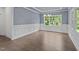 Spacious dining room with hardwood floors, chandelier and natural light at 543 Allessandra Dr, Clayton, NC 27527