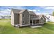 Expansive backyard view of this home featuring neutral siding, and a spacious covered porch at 543 Allessandra Dr, Clayton, NC 27527