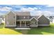 Expansive home featuring a covered porch, neutral siding, complemented by a well-maintained lawn at 543 Allessandra Dr, Clayton, NC 27527