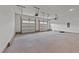 Spacious three car garage with automatic doors and overhead storage for your vehicles and tools at 543 Allessandra Dr, Clayton, NC 27527