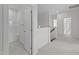 Upstairs hallway features a bathroom with tub insert and carpeted floors at 543 Allessandra Dr, Clayton, NC 27527