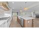 Modern kitchen featuring stainless steel appliances and a large island at 543 Allessandra Dr, Clayton, NC 27527