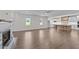 Open-concept living space boasts bright windows, a cozy fireplace, and a modern kitchen with a spacious island at 543 Allessandra Dr, Clayton, NC 27527