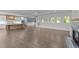 Open-concept living space features a modern kitchen, cozy breakfast nook, and seamless flow to the Gathering room with fireplace at 543 Allessandra Dr, Clayton, NC 27527