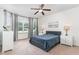 Relaxing bedroom features a ceiling fan, neutral carpeting, and bedside tables at 543 Callandale Ln, Durham, NC 27703