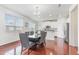 Dining area featuring wood floors, ample natural light, and a view to the kitchen at 543 Callandale Ln, Durham, NC 27703