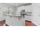 Bright kitchen features granite countertops, white cabinets, stainless steel appliances, and an island at 543 Callandale Ln, Durham, NC 27703