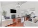 Open living space with fireplace, hardwood floors, and views of the dining and kitchen areas at 543 Callandale Ln, Durham, NC 27703