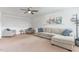 Bright living room with neutral carpeting, ceiling fan and comfortable seating at 543 Callandale Ln, Durham, NC 27703