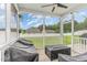 Cozy screened porch with string lights and a view of the backyard at 543 Callandale Ln, Durham, NC 27703