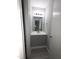 Stylish half-bathroom featuring a gray vanity and modern fixtures for a sleek design at 5893 Shady Grove Cir, Raleigh, NC 27609