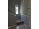 Inviting entryway with stairs and small window providing natural light at 5893 Shady Grove Cir, Raleigh, NC 27609