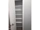 View of a white pantry with multiple shelves inside a home, providing ample storage space at 5893 Shady Grove Cir, Raleigh, NC 27609