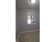 A naturally lit room with tile flooring and neutral walls, creating a serene and adaptable space at 5893 Shady Grove Cir, Raleigh, NC 27609