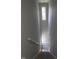 Staircase with a charming pendant light, brightening the way to the upper level at 5893 Shady Grove Cir, Raleigh, NC 27609