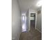 Well-lit staircase with carpeted steps leading to the upper level of the home at 5893 Shady Grove Cir, Raleigh, NC 27609