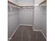 A walk-in closet with rods installed, providing efficient storage for clothes and accessories at 5893 Shady Grove Cir, Raleigh, NC 27609