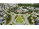 An aerial view of the community showcasing manicured common areas surrounded by lovely homes at 690 Great Ridge Pkwy, Chapel Hill, NC 27516