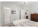 Well lit bedroom with carpet, neutral colors, and a comfortable queen size bed at 690 Great Ridge Pkwy, Chapel Hill, NC 27516