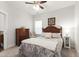 Cozy bedroom with a queen bed, dresser, and ceiling fan for comfortable living at 690 Great Ridge Pkwy, Chapel Hill, NC 27516