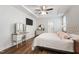 Bright bedroom features wood floors, ceiling fan, tray ceilings and multiple dressers at 690 Great Ridge Pkwy, Chapel Hill, NC 27516
