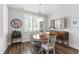 Bright dining room features a wood table, wood floors, stylish decor, and lots of natural light at 690 Great Ridge Pkwy, Chapel Hill, NC 27516