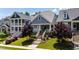 Inviting two-story home with well-manicured lawn, colorful flowerbeds, and a welcoming front porch at 690 Great Ridge Pkwy, Chapel Hill, NC 27516