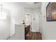 Bright hallway with hardwood floors and white trim leads to bedrooms at 690 Great Ridge Pkwy, Chapel Hill, NC 27516