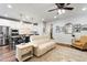 Open concept space with a cozy living room area that flows into a modern kitchen with an island and barstool seating at 690 Great Ridge Pkwy, Chapel Hill, NC 27516